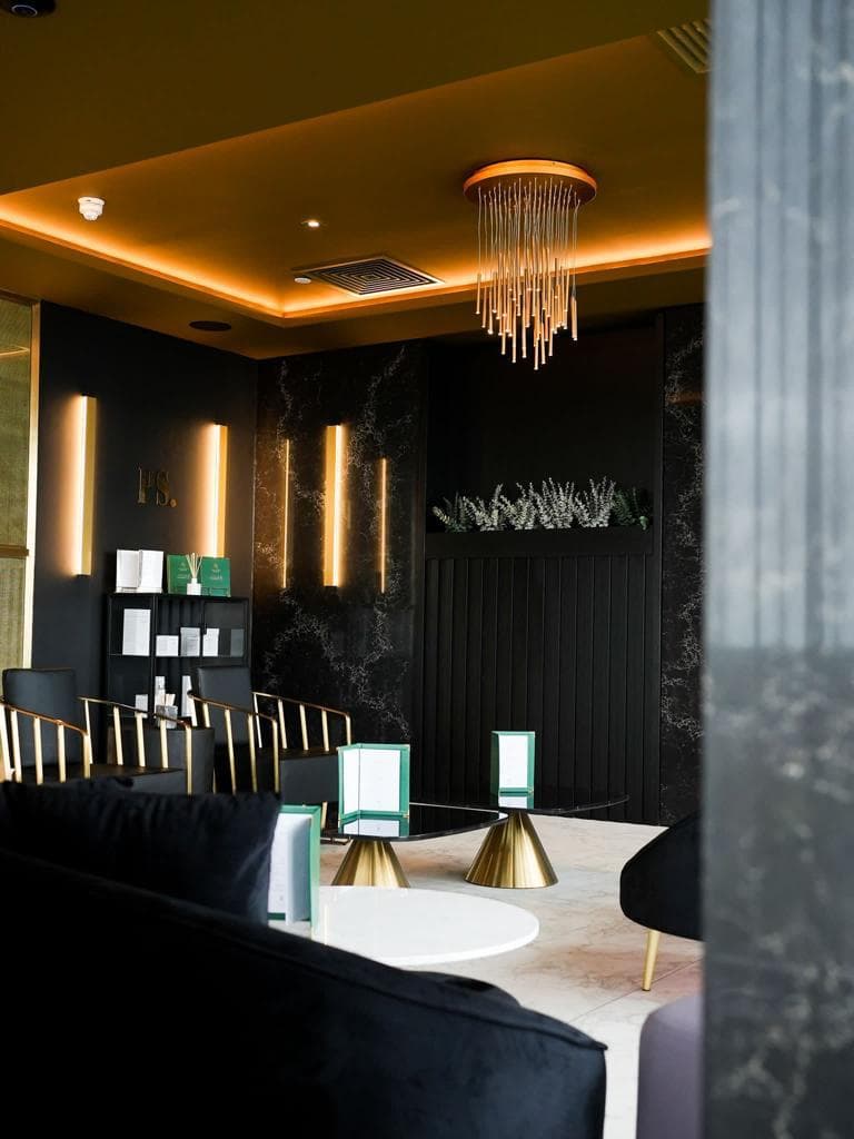 The lounge bar at Parliament Square, beneath the brass chandelier.